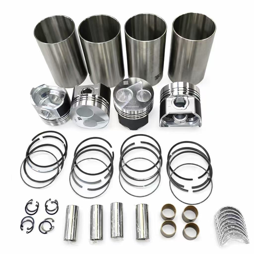 Complete engine overhaul kit including pistons, rings, gaskets, and bearings for diesel engine